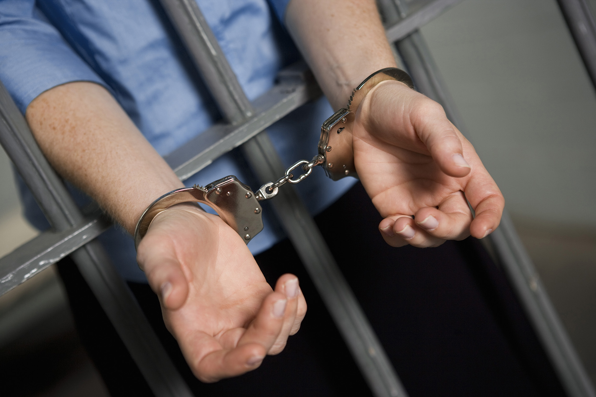Man in handcuffs in jail